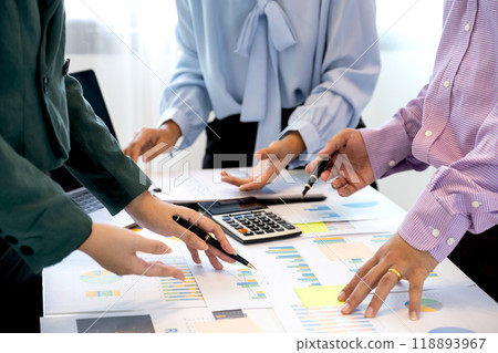 businesswomen and businessmen team meeting to plan strategies to increase business income. Have a brainstorming finance graph analysis and discussing for the new target success businesswomen and businessmen team meeting to plan strategies to increase business income. Have a brainstorming finance graph analysis and discussing for the new target success 118893967