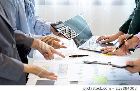businesswomen and businessmen team meeting to plan strategies to increase business income. Have a brainstorming finance graph analysis and discussing for the new target success businesswomen and businessmen team meeting to plan strategies to increase business income. Have a brainstorming finance graph analysis and discussing for the new target success 118894008