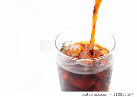 Close-up of iced coffee being poured into a glass 118895104