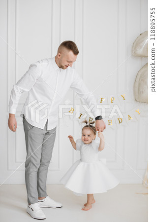 Father and daughter celebrating her birthday with joy Father and daughter celebrating her birthday with joy 118895755