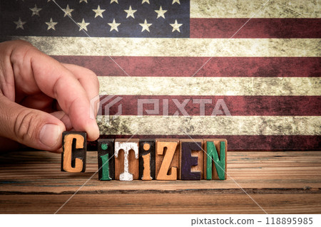 CITIZEN. Colorful letters of the alphabet on a wooden texture table 118895985