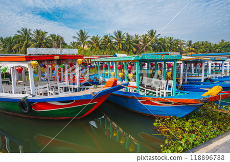 Traditional wooden Vietnamese boats on Thu bon river in the old town in Hoi An in Vietnam in summer Traditional wooden Vietnamese boats on Thu bon river in the old town in Hoi An in Vietnam in summer 118896788