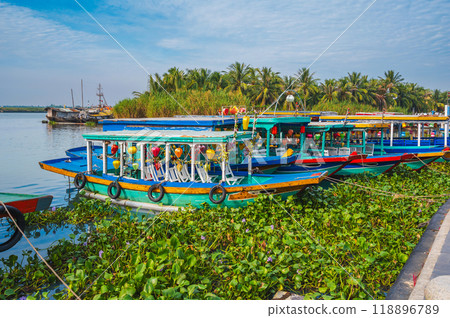 Vietnamese boats on the Thu bon river in old town in Hoi An in Vietnam in summer Vietnamese boats on the Thu bon river in old town in Hoi An in Vietnam in summer 118896789