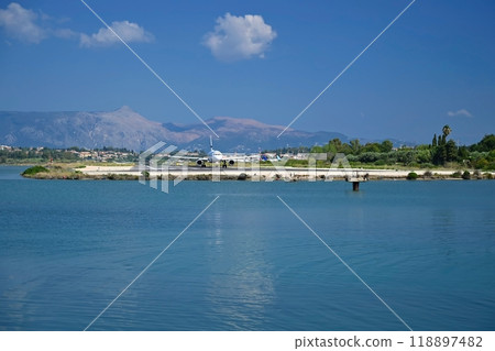 Airports by the sea and aircraft landing over water. Aircraft tracking point. Corfu Island Greece. Concept for holidays, travel and transportation by plane. 118897482
