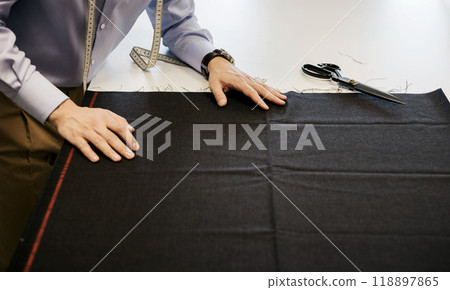 elegant tailor at work 118897865