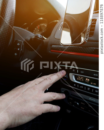 Male Hand Adjusting Air Conditioner In Car Male Hand Adjusting Air Conditioner In Car 118897876