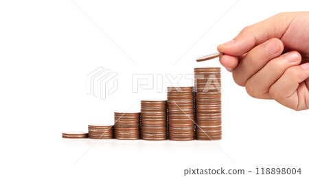 Hand laying coins on stacks coins in  row 118898004