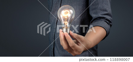Humans hold light bulbs in hand innovative technology and creativity 118898007
