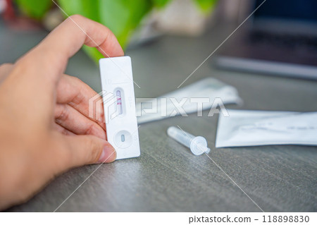 Rapid Antigen Test kit with with Positive result during swab COVID-19 testing. Coronavirus Self nasal or Home test, Autumn exacerbation of viruses 118898830