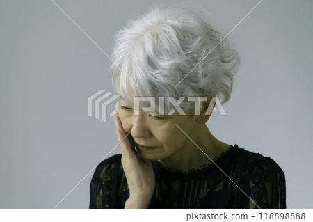 Depressed gray-haired senior woman Depressed gray-haired senior woman 118898888