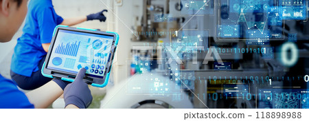 Engineers inspecting factory machinery and piping with digital technology Horizontal visual for banners and advertisements Engineers inspecting factory machinery and piping with digital technology Horizontal visual for banners and advertisements 118898988