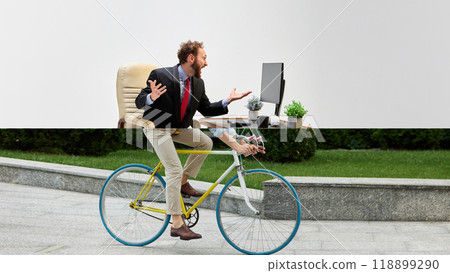 Businessman cyclist. Creative collage. Businessman at desk merges with cyclist on yellow bike below. 118899290
