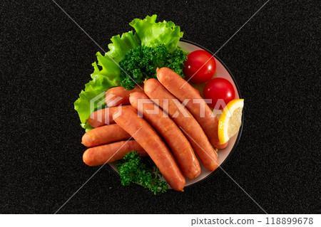 Coarsely ground sausages served on a plate, top view 118899678