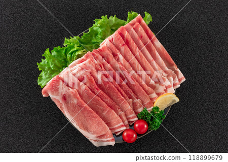 Sliced pork shoulder meat on a plate, top view Sliced pork shoulder meat on a plate, top view 118899679