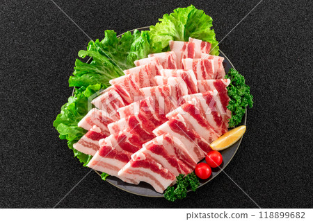 Pork belly for yakiniku served on a plate, overhead view 118899682