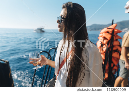 Enjoy a Serene Yacht Experience while savoring a Refreshing Beverage on the water Enjoy a Serene Yacht Experience while savoring a Refreshing Beverage on the water 118900909