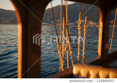 Sailing Serenity Experiencing the Golden Hour Beauty on the Waters Calm Surface Sailing Serenity Experiencing the Golden Hour Beauty on the Waters Calm Surface 118900935