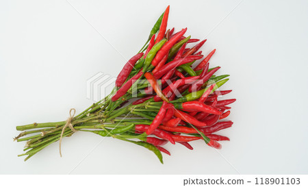 Raw chili peppers on stems 118901103