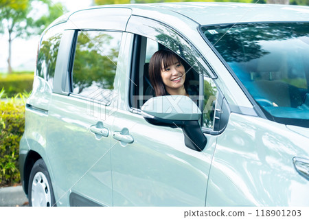 A woman driving a car A woman going for a drive 118901203
