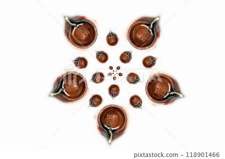 Happy Diwali - Top view of traditional clay oil lamps isolated on white background for Hindu festival celebrations. Happy Diwali - Top view of traditional clay oil lamps isolated on white background for Hindu festival celebrations. 118901466