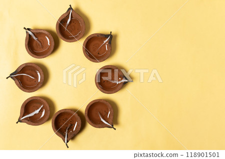 Hindu traditional clay diya arrangement for Diwali celebration on white background. 118901501