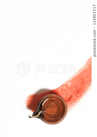 Hindu tradition Diwali diya oil lamps burning over paint stroke on white background. Hindu tradition Diwali diya oil lamps burning over paint stroke on white background. 118901517