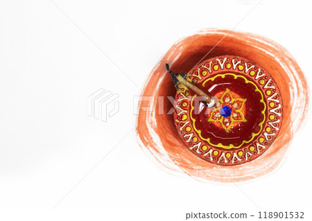 Hindu tradition Diwali diya oil lamps burning over paint stroke on white background. 118901532