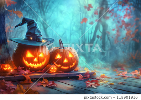 Halloween jack-o'-lanterns and witch hats decorate an autumn forest 118901916