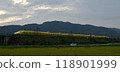A yellow Shinkansen train racing through the Showa era countryside 118901999