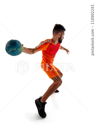 Dynamic image of young bearded man in orange uniform, handball player in motion, playing, training isolated on white background Dynamic image of young bearded man in orange uniform, handball player in motion, playing, training isolated on white background 118902281