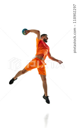 Powerful determined man, handball athlete in orange uniform in motion during game, throwing ball isolated on white background Powerful determined man, handball athlete in orange uniform in motion during game, throwing ball isolated on white background 118902297