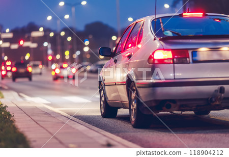 The car is standing on a pedestrian crossing waiting for the pedestrian to cross the crossing. 118904212