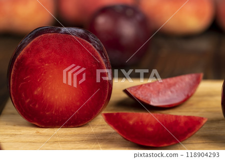 red ripe plum during cooking and slicing 118904293