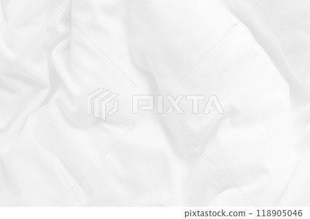 Close up top view of white bedding sheet and wrinkle messy blanket in bedroom after wake up in the morning. 118905046