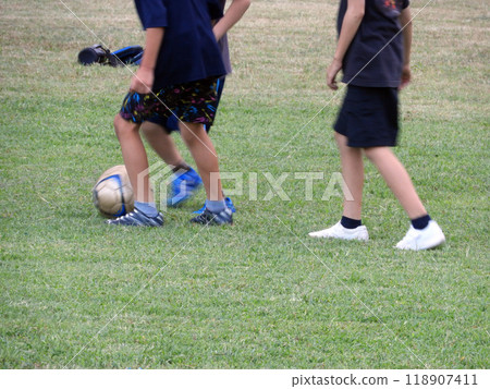 A boy playing football A boy playing football 118907411