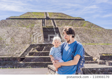 Father and son tourists exploring Teotihuacan, Mexico. Cultural heritage, ancient ruins, and archaeological adventure concept Father and son tourists exploring Teotihuacan, Mexico. Cultural heritage, ancient ruins, and archaeological adventure concept 118908170