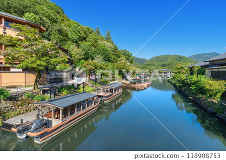 Togetsu-kobashi Bridge in Arashiyama, Kyoto: Houseboat and shuttle boat dock Togetsu-kobashi Bridge in Arashiyama, Kyoto: Houseboat and shuttle boat dock 118908753