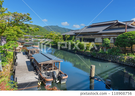 Togetsu-kobashi Bridge in Arashiyama, Kyoto: Houseboat and shuttle boat dock Togetsu-kobashi Bridge in Arashiyama, Kyoto: Houseboat and shuttle boat dock 118908756