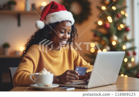 Cheerful woman shopping online home with a festive atmosphere 118909125