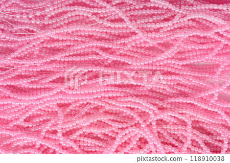 Full frame pink beads on fishing line as background. 118910038