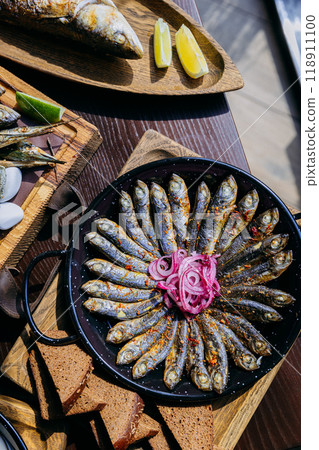 Delicious seafood assortment featuring grilled fish, sardines, oysters. Perfect for gourmet dinner Delicious seafood assortment featuring grilled fish, sardines, oysters. Perfect for gourmet dinner 118911100