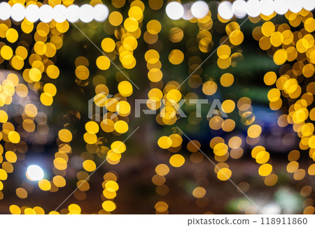 Christmas blurred background. Christmas tree decorated with garlands is out of focus. 118911860