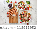 Colorful pasta salad with fresh vegetables and sausages 118911952