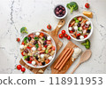Colorful pasta salad with fresh vegetables and sausages 118911953