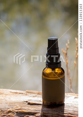 Spray Bottle on Rustic Wooden Surface 118913163