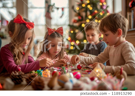 Children gathered around a table making handmade Christmas ornaments with colorful craft supplies 118913290