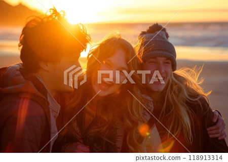 A group of friends laughing together on the beach at sunset, the warm glow of the evening sky reflecting the joy and optimism shared in their carefree moments 118913314