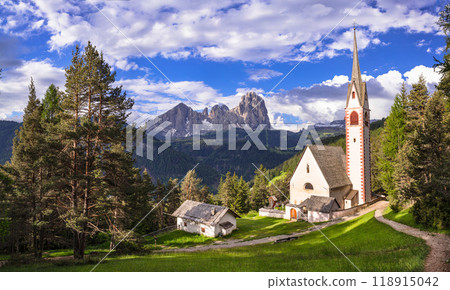 Val Gardena, South Tyrol, Italy. Alpine scenery. Beautiful Dolomites mountains. view of San Giacomo church near Ortisei village. Val Gardena, South Tyrol, Italy. Alpine scenery. Beautiful Dolomites mountains. view of San Giacomo church near Ortisei village. 118915042