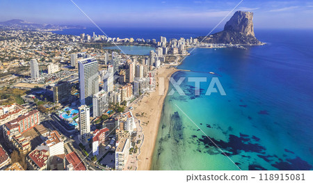 Costa Blanca, Spain. Aerial drone panoramic view of coastal city Calpe with great beaches. Costa Blanca, Spain. Aerial drone panoramic view of coastal city Calpe with great beaches. 118915081