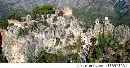 Landmarks of Spain. medieval village Guadalest, aerial drone view scenery with castle on the rock Landmarks of Spain. medieval village Guadalest, aerial drone view scenery with castle on the rock 118915084
